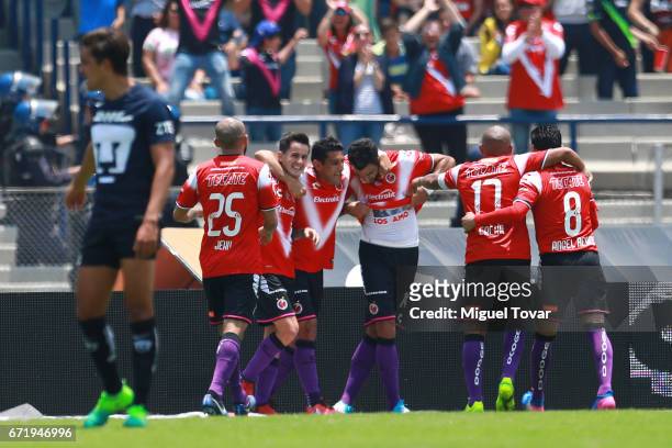 Cristian Pellerano of Veracruz celebrates with teammates after scoring the second goal of his team during the 15th round match between Pumas UNAM and...