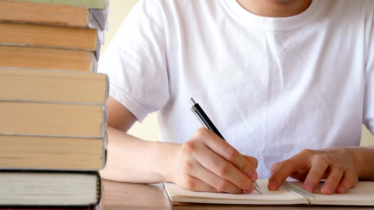 Writing Notebook Stack 112 Writing Stack Of Paper Desk Stock Videos, Footage, & 4K Video Clips ...