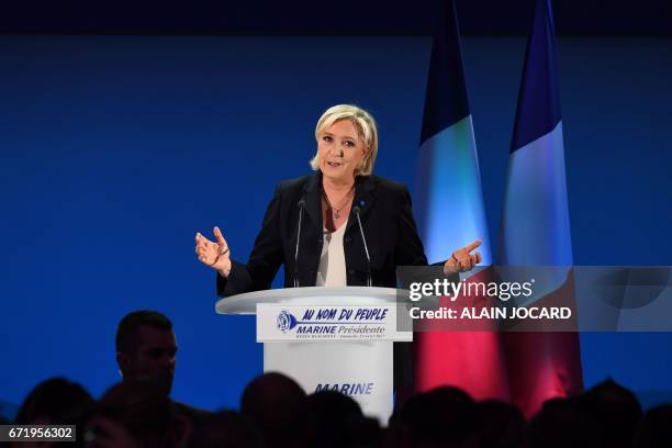 French presidential election candidate for the far-right Front National party Marine Le Pen delivers a speech in Henin-Beaumont, on April 23 after...