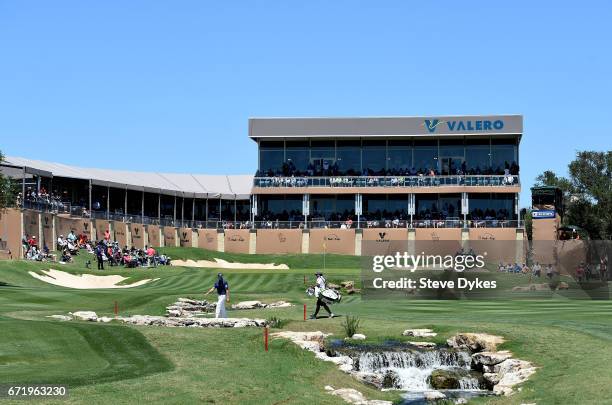 Adam Hadwin of Canada walks across the 18th fairway during the final round of the Valero Texas Open at TPC San Antonio AT&T Oaks Course on April 23,...