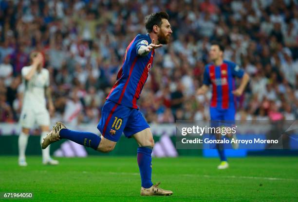 Lionel Messi of Barcelona celebrates as he scores their first and equalising goal with team mates during the La Liga match between Real Madrid CF and...