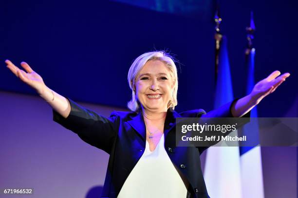 National Front leader Marine Le Pen addresses activists at the Espace Francios Mitterrand on April 23, 2017 in Henin Beaumont, France. According to...