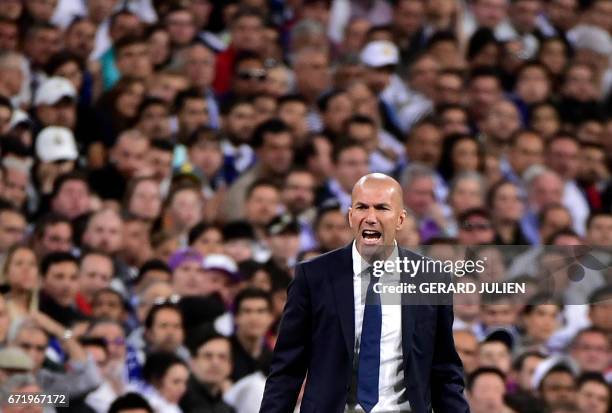 Real Madrid's French coach Zinedine Zidane shouts on the sideline during the Spanish league Clasico football match Real Madrid CF vs FC Barcelona at...
