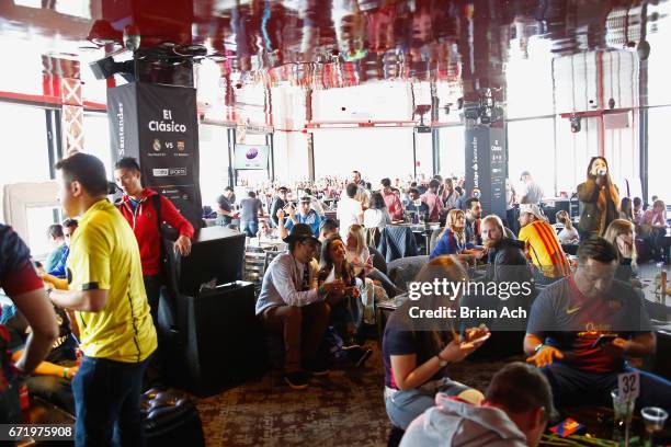 Fans attend a roofop viewing party of El Clasico - Real Madrid CF vs FC Barcelona hosted by LaLiga at 230 Fifth Avenue on April 23, 2017 in New York...