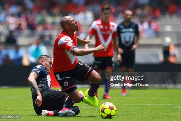 Nicolas Castillo of Pumas makes a foul over Egidio Arevalo of Veracruz during the 15th round match between Pumas UNAM and Veracruz as part of the...