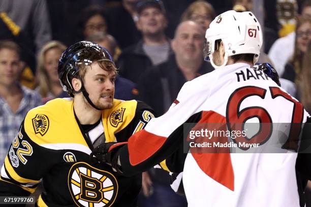 Sean Kuraly of the Boston Bruins fights Ben Harpur of the Ottawa Senators during the first period of Game Six of the Eastern Conference First Round...