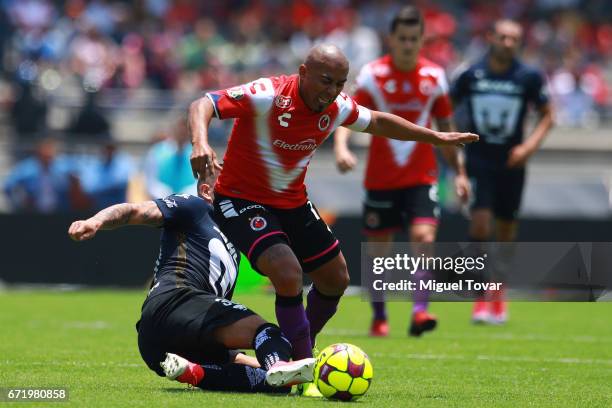 Nicolas Castillo of Pumas makes a foul over Egidio Arevalo of Veracruz during the 15th round match between Pumas UNAM and Veracruz as part of the...