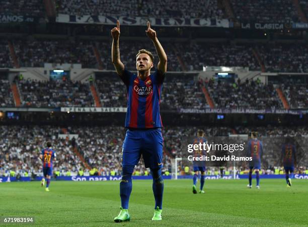 Ivan Rakitic of Barcelona celebrates as he scores their second goal during the La Liga match between Real Madrid CF and FC Barcelona at Estadio...