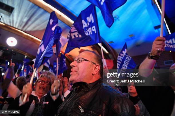 Supporters of National Front leader Marine Le Pen cheer in celebration in the Espace Francios Mitterrand on April 23, 2017 in Henin Beaumont, France....