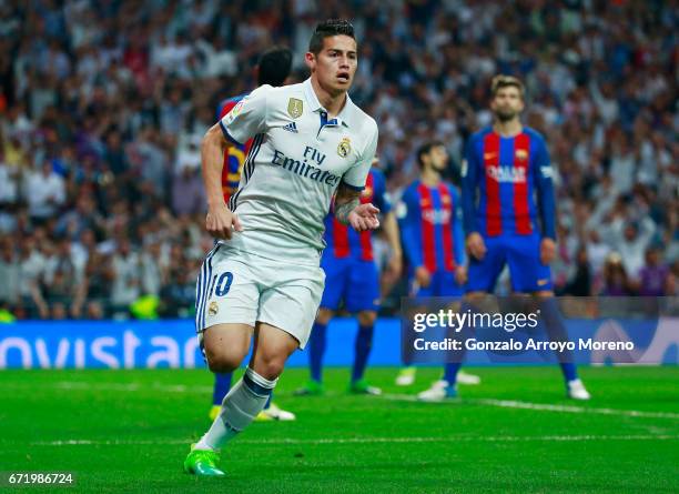 James Rodriguez of Real Madrid celebrates as he scores their second goal during the La Liga match between Real Madrid CF and FC Barcelona at Estadio...