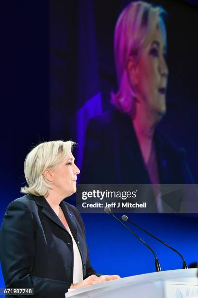 National Front leader Marine Le Pen addresses activists at the Espace Francios Mitterrand on April 23, 2017 in Henin Beaumont. According to projected...
