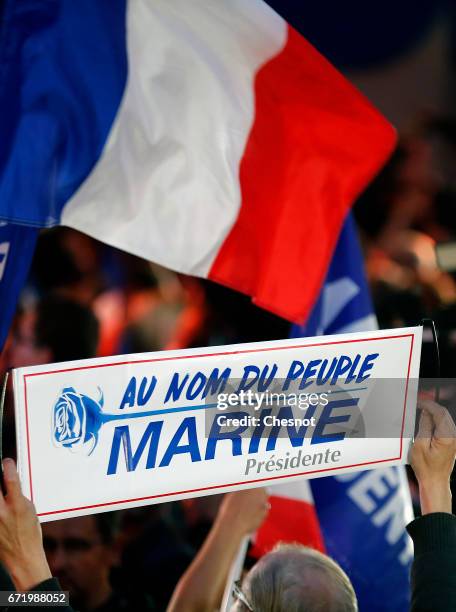 Supporters of National Front leader Marine Le Pen cheer in celebration in the Espace Francios Mitterrand on April 23, 2017 in Henin Beaumont, France....