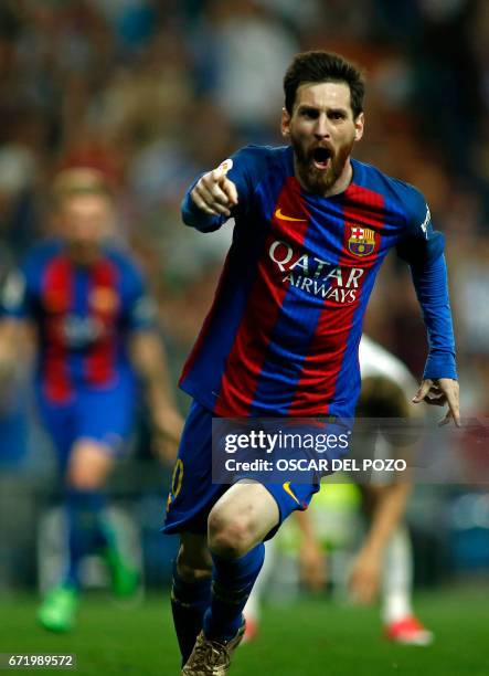 Barcelona's Argentinian forward Lionel Messi celebrates Barcelona's third goal during the Spanish league football match Real Madrid CF vs FC...