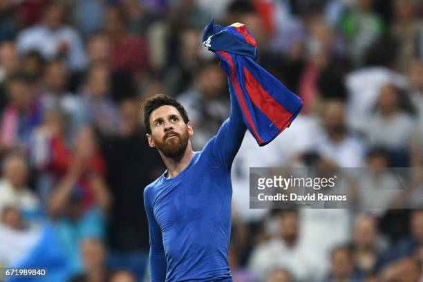 Lionel Messi of Barcelona celebrates as he scores their third goal during the La Liga match between Real Madrid CF and FC Barcelona at Estadio...