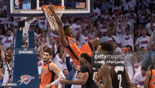Jerami Grant of the Oklahoma City Thunder slams two points into the basket against the Houston Rockets during the first half of Game Four in the 2017...
