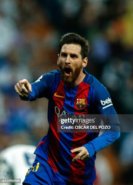 Barcelona's Argentinian forward Lionel Messi celebrates after scoring during the Spanish league Clasico football match Real Madrid CF vs FC Barcelona...