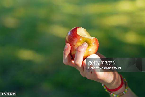 the bitten apple - apple bite out stock pictures, royalty-free photos & images