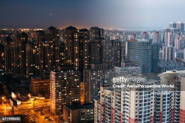 beijing residential area cityscape, night to day transition - day and night image series stock pictures, royalty-free photos & images