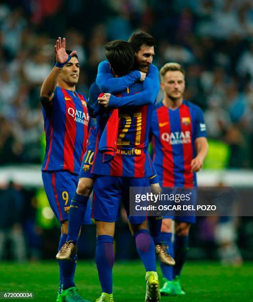 Barcelona's Argentinian forward Lionel Messi Cback) celebrates with Barcelona's Portuguese midfielder Andre Gomes after scoring during the Spanish...