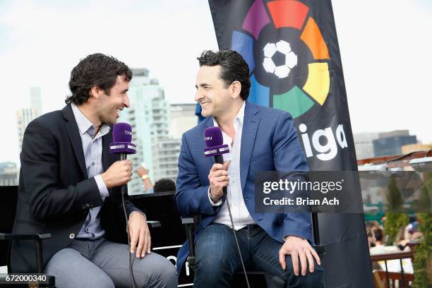 Tv Correspondent Julian Gonzalez interviews retired soccer player Raul Gonzalez at a roofop viewing party of El Clasico - Real Madrid CF vs FC...