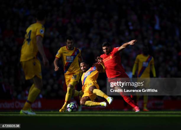 Emre Can of Liverpool is tackled by Jason Puncheon of Crystal Palace during the Premier League match between Liverpool and Crystal Palace at Anfield...