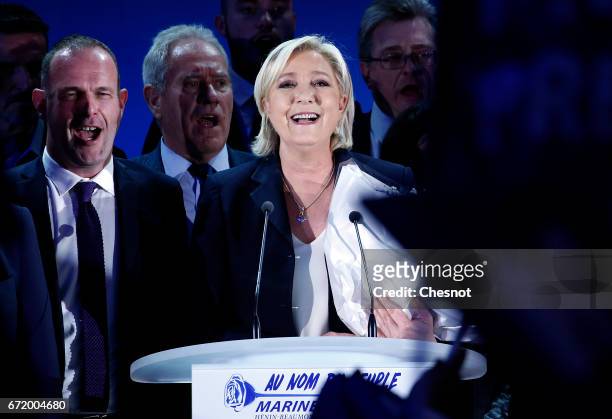 National Front leader Marine Le Pen addresses activists at the Espace Francios Mitterrand on April 23, 2017 in Henin Beaumont, France. According to...