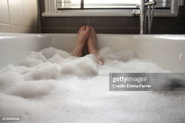 point of view - person having bath - bubble bath stock pictures, royalty-free photos & images