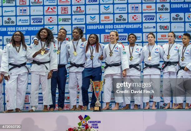 The bronze medal winning German women's team line up after receiving their medals and cup during the 2017 Warsaw European Judo Championships at the...