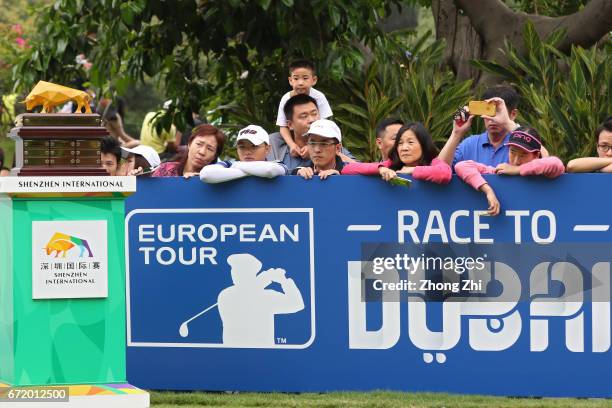 Fans and supporters look at the trophy during the final round of the Shenzhen International at Genzon Golf Club on April 23, 2017 in Shenzhen, China.