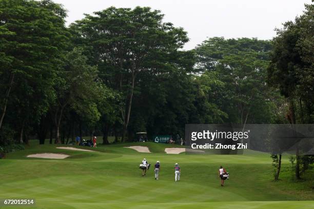 Bubba Watson of the United States and Gregory Bourdy of France in action during the final round of the Shenzhen International at Genzon Golf Club on...