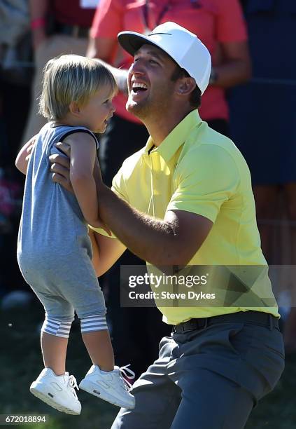 Kevin Chappell celebrates with his son Wyatt after putting in to win on the 18th green during the final round of the Valero Texas Open at TPC San...