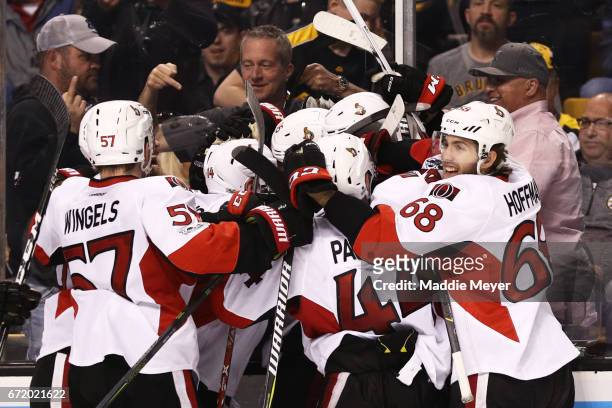 Mike Hoffman, Tommy Wingels, Jean-Gabriel Pageau and Alex Burrows celebrate with Clarke MacArthur of the Ottawa Senators after he scored the game...