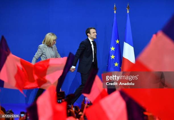 French centrist, independent candidate Emmanuel Macron and his wife Brigitte Trogneux arrive for addressing supporters after winning the lead...