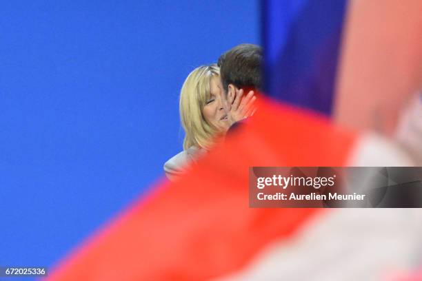 Founder and Leader of the political movement 'En Marche !' Emmanuel Macron and his wife Brigitte Trogneux kiss as they arrive for his speech after...