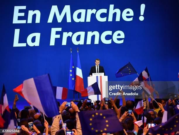 French centrist, independent candidate Emmanuel Macron addresses supporters after winning the lead percentage of votes with 24 percent in the first...