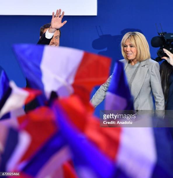 French centrist, independent candidate Emmanuel Macron and his wife Brigitte Trogneux arrive for addressing supporters after winning the lead...