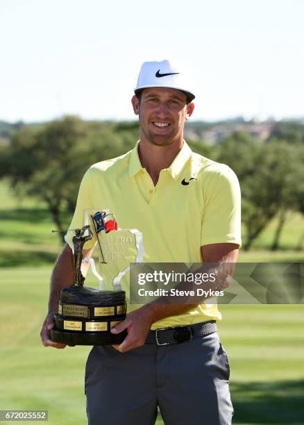 Kevin Chappell celebrates with the trophy during the final round of the Valero Texas Open at TPC San Antonio AT&T Oaks Course on April 23, 2017 in...