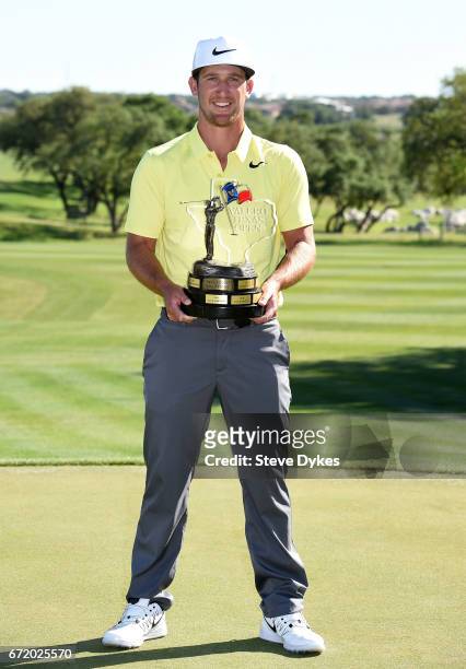 Kevin Chappell celebrates with the trophy during the final round of the Valero Texas Open at TPC San Antonio AT&T Oaks Course on April 23, 2017 in...
