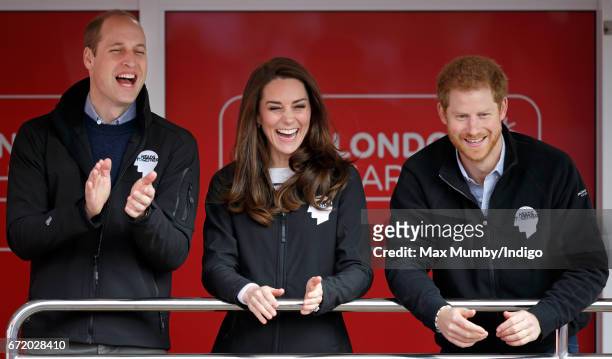 Prince William, Duke of Cambridge, Catherine, Duchess of Cambridge and Prince Harry cheer on runners as they start the 2017 Virgin Money London...