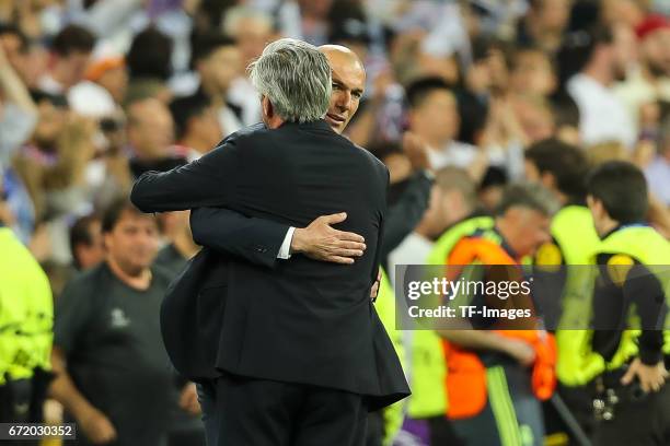 Head coach Carlo Ancelotti of Munich shakes hands with Head coach Zinedine Zidane of Real Madrid during the UEFA Champions League Quarter Final...