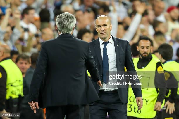 Head coach Carlo Ancelotti of Munich shakes hands with Head coach Zinedine Zidane of Real Madrid during the UEFA Champions League Quarter Final...