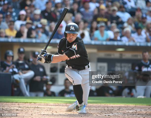 Ichiro Suzuki of the Miami Marlins takes a strike while at bat during the eighth inning of a baseball game against the San Diego Padres at PETCO Park...