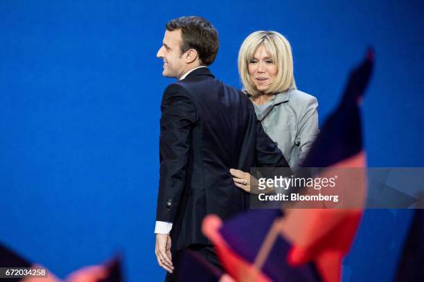 Emmanuel Macron, France's independent presidential candidate, and his wife Brigitte Trogneux arrive to deliver a speech after the first round of the...