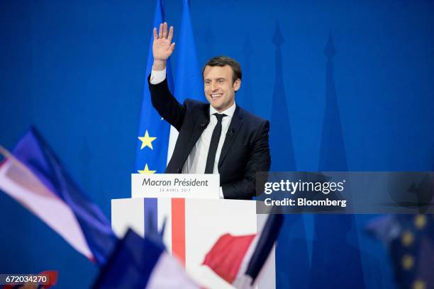 Emmanuel Macron, France's independent presidential candidate, waves while speaking with attendees after the first round of the French presidential...