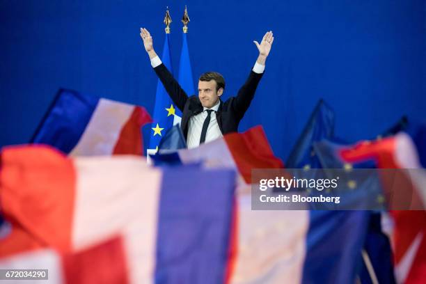 Emmanuel Macron, France's independent presidential candidate, waves while speaking with attendees after the first round of the French presidential...