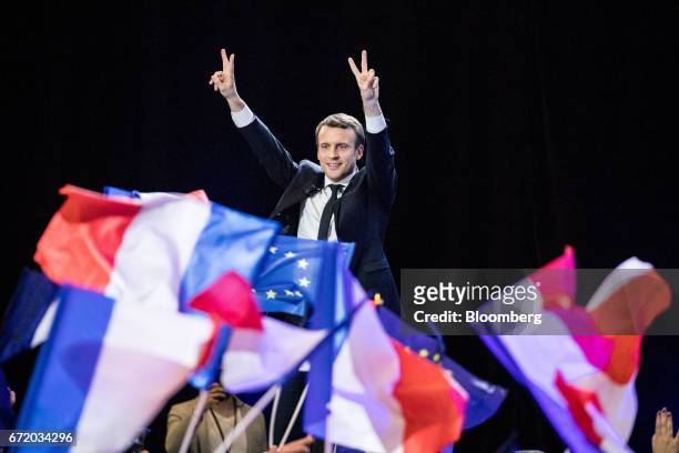 Emmanuel Macron, France's independent presidential candidate, gestures while speaking with attendees after the first round of the French presidential...