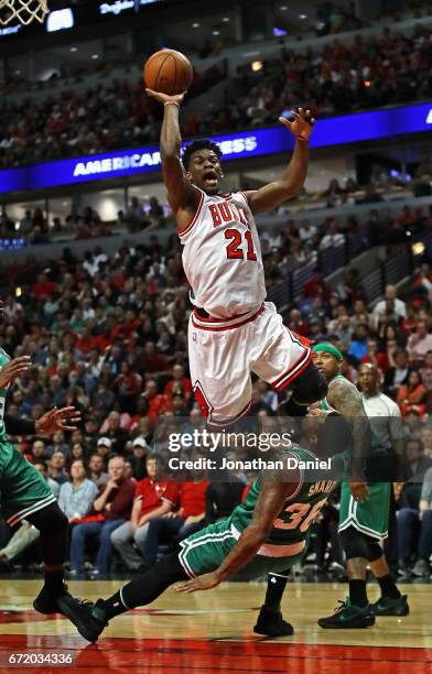 Jimmy Butler of the Chicago Bulls is fouled while shooting by Marcus Smart of the Boston Celtics during Game Four of the Eastern Conference...