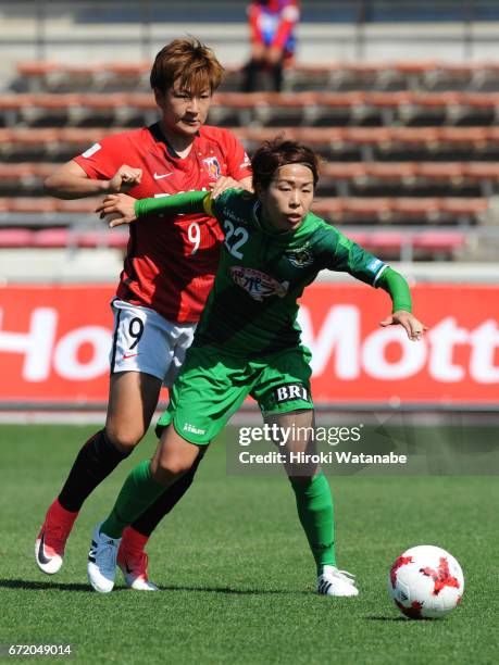 Azusa Iwashimizu of NTV Beleza and Yuika Sugawara of Urawa Red Diamonds Ladies compete for the ball during the Nadeshiko League match between Ladies...