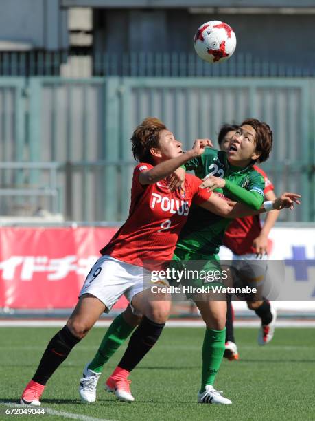 Azusa Iwashimizu of NTV Beleza and Yuika Sugawara of Urawa Red Diamonds Ladies compete for the ball during the Nadeshiko League match between Ladies...