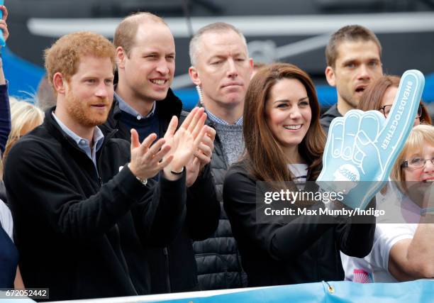 Prince Harry, Prince William, Duke of Cambridge and Catherine, Duchess of Cambridge cheer on runners talking part in the 2017 Virgin Money London...